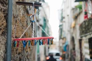 old white plastic clothespins hang photo