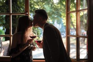 Young couple by the window photo