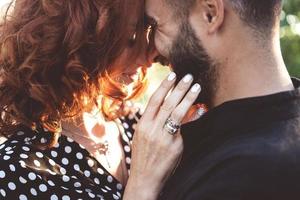 loving guy and girl posing together on camera photo