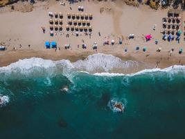 Beach with sun loungers on the coast of the ocean photo