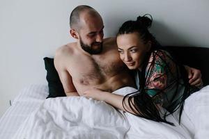 man and woman on the bed photo