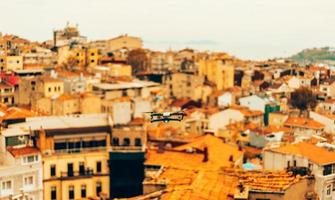 Drone flying above old city, selective focus photo