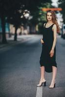 pretty girl posing in a city street photo