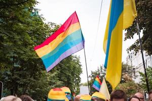 Rainbow flags waving over the crowd during the Pride Parade photo