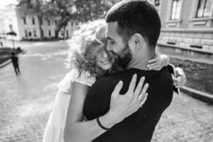 Cute couple hugging on the street photo