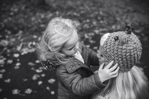 Mother with daughter in autumn park photo