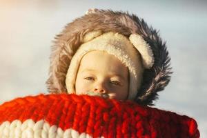 Little girl child sitting on sledges photo