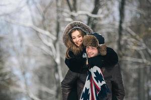 man carries a girl on his back photo