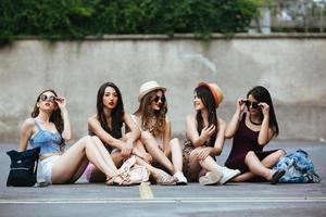 Five beautiful young girls relaxing photo