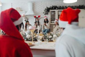 Multi-ethnic young people celebrating New year eve at party photo