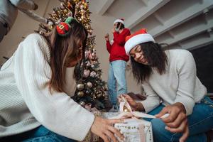 Beautiful girl exchange gifts for the new year. photo