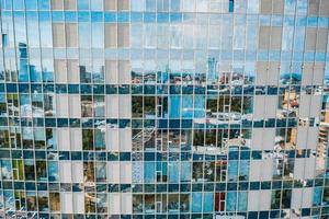 Street reflection on glass steel building facade photo