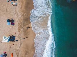 Beach with sun loungers on the coast of the ocean photo