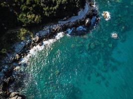 Drone top view of a sea cliff and a beach photo