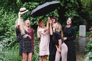 six girls with an umbrella photo