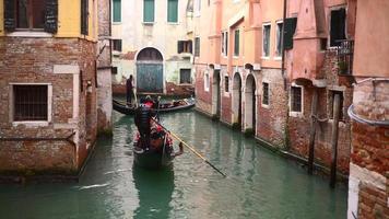 Venetian channel with ancient houses and boats photo