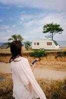 Beautiful, young girl posing on a wild seashore photo