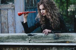 Vintage witch with elixir in hand photo