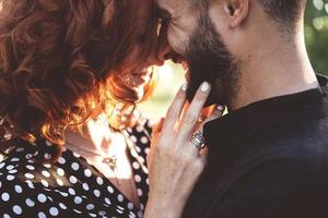 loving guy and girl posing together on camera photo