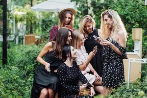 Six girls with mobile phones photo