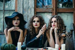 three witches at the table photo