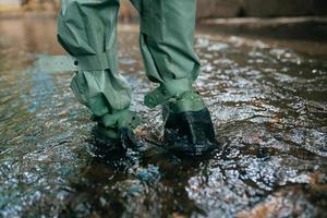 Close up view of waterproof pants boots photo
