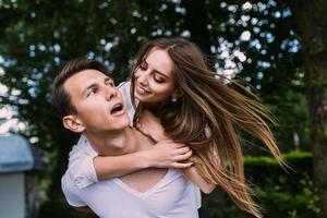 Young adult brunette man and woman in the park photo