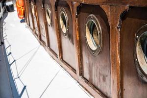 Close board of an old wooden yacht photo