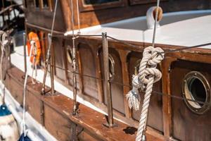 Close board of an old wooden yacht photo