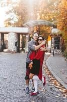 Couple in love walking in the autumn streets photo