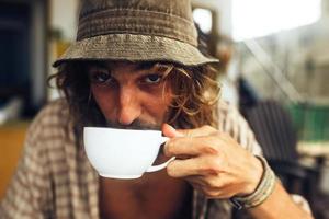 bearded guy drinking coffee photo