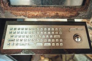 Very old computer, rusty keyboard with monitor photo