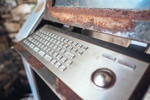 Very old computer, rusty keyboard with monitor photo