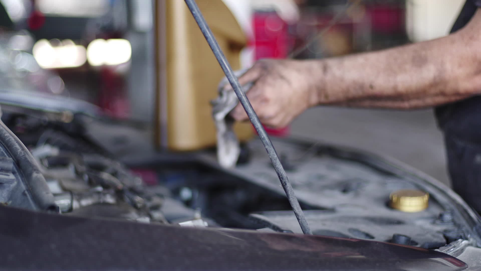 Car Engine Oil Level Check With Dipstick Blurry Footage. 11372116 Stock