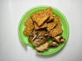 Fried chicken and tempeh on a white background photo