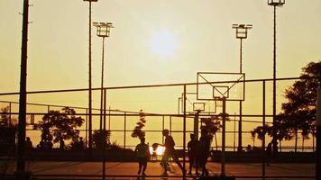 People Playing Basketball on Wire Mesh Outdoor Court video