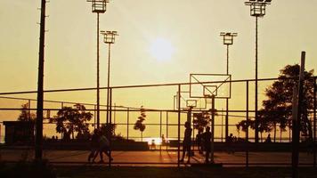 People Playing Basketball on Wire Mesh Outdoor Court video