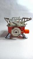 Portable mini gas stove on white background photo