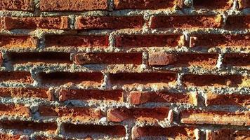 The red brick wall is starting to break photo