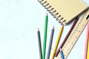 Wooden crayons scattered on the table, wooden rulers and notebooks with the festival back to the semester, students go to school, art lessons. photo