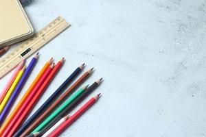 Wooden crayons scattered on the table, wooden rulers and notebooks with the festival back to the semester, students go to school, art lessons. photo