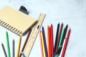 Wooden crayons scattered on the table, wooden rulers and notebooks with the festival back to the semester, students go to school, art lessons. photo