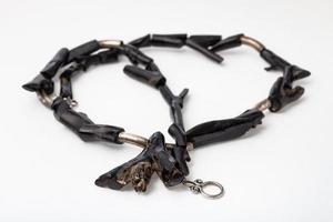 coiled necklace from polished black coral twigs photo