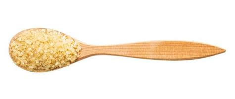 view of demerara brown cane sugar in wood spoon photo