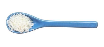 coconut flakes in ceramic spoon isolated photo