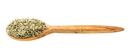 wooden spoon with anise seeds isolated photo