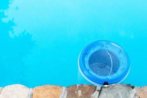 water filter at the wall of outdoor swimming pool photo