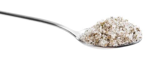 teaspoon with seasoned salt with spices close up photo