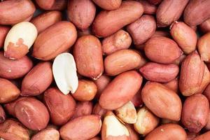 background - many shelled peanut seeds photo