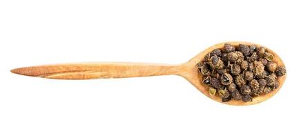 top view of wood spoon with sichuan pepper photo